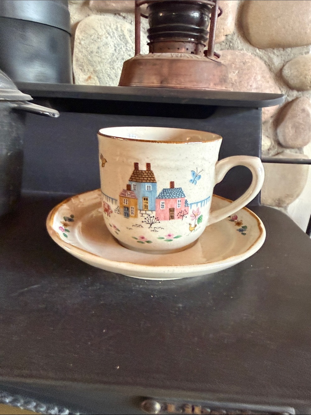 International Heartland Cottage Cup & Saucer Set in Cream with Pastel Houses